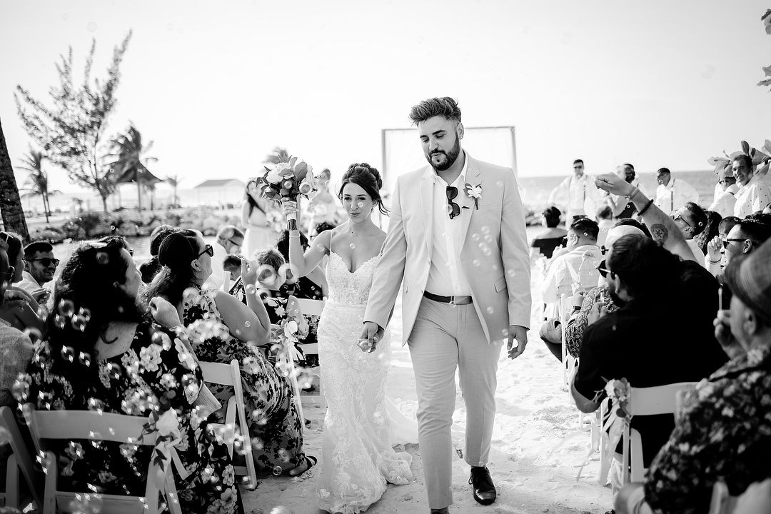 Black and white beach wedding recessional with bubbles Ocho Rios Jamaica