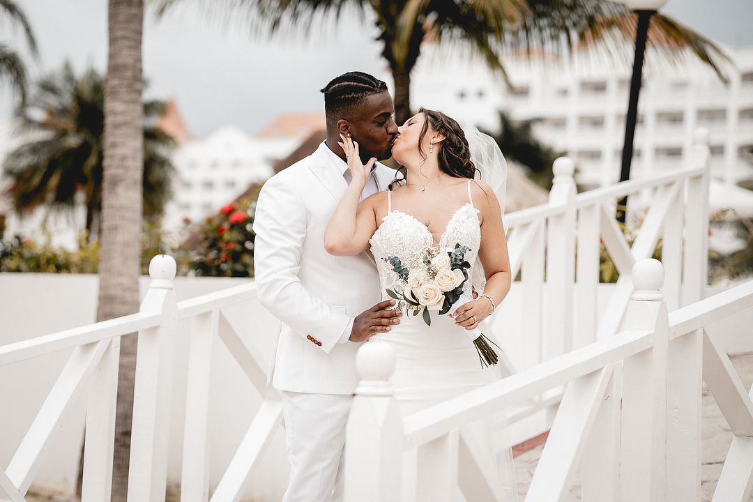 Couple kissing on white bridge wedding photography Ocho Rios Jamaica